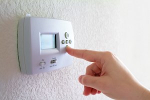 thermostat and human hand